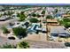 Aerial view of neighborhood with home, showing solar panels, workshop, and adjacent houses at 4682 Tamalpias Ave, Las Vegas, NV 89120