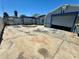 Fenced backyard with a detached garage, sun exposure, and concrete flooring at 4682 Tamalpias Ave, Las Vegas, NV 89120