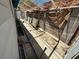 Small, narrow backyard space with concrete and brick walls at 4682 Tamalpias Ave, Las Vegas, NV 89120