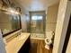 Bathroom features a granite vanity, framed mirror, and glass-enclosed shower at 4682 Tamalpias Ave, Las Vegas, NV 89120