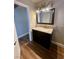 Nicely-designed bathroom with granite vanity, framed mirror, and modern lighting fixture at 4682 Tamalpias Ave, Las Vegas, NV 89120