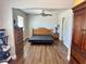 Bedroom features a ceiling fan and wood-look floors at 4682 Tamalpias Ave, Las Vegas, NV 89120