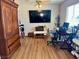 Bedroom with closet features wood-look floors and an entertainment center at 4682 Tamalpias Ave, Las Vegas, NV 89120