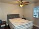 Bedroom features a ceiling fan, wood-look floors, and a window at 4682 Tamalpias Ave, Las Vegas, NV 89120