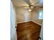 Cozy bedroom with wood-look floors, a window, and a ceiling fan at 4682 Tamalpias Ave, Las Vegas, NV 89120