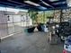 Enclosed carport featuring a small decorative tree and plenty of storage space at 4682 Tamalpias Ave, Las Vegas, NV 89120