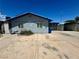 View of the home with a gated carport and concrete driveway on a sunny day at 4682 Tamalpias Ave, Las Vegas, NV 89120