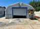 Garage with roll-up door, lighting, and concrete floor at 4682 Tamalpias Ave, Las Vegas, NV 89120