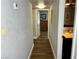 Hallway shows wood-look floors and access to the main bedroom and bathroom at 4682 Tamalpias Ave, Las Vegas, NV 89120