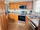 Functional kitchen features oak cabinets, and a stainless steel appliance at 4682 Tamalpias Ave, Las Vegas, NV 89120