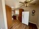 Kitchen with stainless steel appliances, wood cabinets, and adjacent dining space at 4682 Tamalpias Ave, Las Vegas, NV 89120