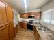 Well-lit kitchen featuring stainless steel appliances, ample counter space, and wood cabinets at 4682 Tamalpias Ave, Las Vegas, NV 89120
