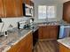 Traditional kitchen features wood cabinets, stainless steel appliances, and laminate countertops at 4682 Tamalpias Ave, Las Vegas, NV 89120