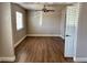 Living room featuring wood-look floors, a window, and a ceiling fan at 4682 Tamalpias Ave, Las Vegas, NV 89120