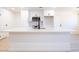 Close up of white kitchen island with sink and modern faucet, microwave and white cabinets at 508 S Jones Blvd, Las Vegas, NV 89107
