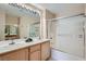 Bathroom with double sinks and shower over tub at 55 E Agate Ave # 202, Las Vegas, NV 89123