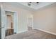 Cozy bedroom with neutral tones, ensuite bathroom, and carpet flooring at 55 E Agate Ave # 202, Las Vegas, NV 89123