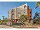 Exterior view of modern residential building with landscaped grounds at 55 E Agate Ave # 202, Las Vegas, NV 89123