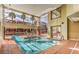 Bright indoor pool area with floor to ceiling windows and access to an outdoor patio area at 55 E Agate Ave # 202, Las Vegas, NV 89123