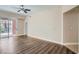 Well-lit living room with wood floors and balcony access at 55 E Agate Ave # 202, Las Vegas, NV 89123