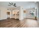 Open-concept living room with wood floors and ceiling fan at 55 E Agate Ave # 202, Las Vegas, NV 89123