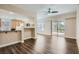 Spacious living room features wood floors and slider to patio at 55 E Agate Ave # 202, Las Vegas, NV 89123
