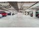 Well-lit parking garage features clearly marked parking spaces at 55 E Agate Ave # 202, Las Vegas, NV 89123