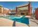 Relaxing outdoor swimming pool surrounded by lounge chairs at 55 E Agate Ave # 202, Las Vegas, NV 89123