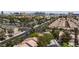 Aerial view of a residential neighborhood with a distant city skyline at 5516 Ness Ave, Las Vegas, NV 89118