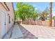 Spacious backyard with decorative tile and lots of trees at 5516 Ness Ave, Las Vegas, NV 89118