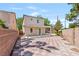 Spacious backyard with a decorative tile patio and partial pergola at 5516 Ness Ave, Las Vegas, NV 89118