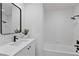 Bathroom features a single vanity, built in bathtub, and shower combo at 5516 Ness Ave, Las Vegas, NV 89118