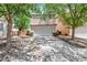 Two-story home with a two-car garage, mature trees, and well-maintained landscaping at 5516 Ness Ave, Las Vegas, NV 89118