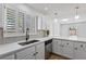 Bright kitchen features white cabinets, stainless steel appliances, and natural light at 5516 Ness Ave, Las Vegas, NV 89118