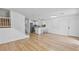 Open-concept living space with a kitchen, hardwood floors, and plenty of natural light at 5516 Ness Ave, Las Vegas, NV 89118