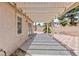Patio with pergola, decorative tile and access to the house at 5516 Ness Ave, Las Vegas, NV 89118