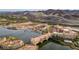 Lake Las Vegas aerial view with colorful buildings, scenic lake, and mountain backdrop on a sunny day at 58 Sun Lily Ln, Henderson, NV 89011