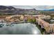 Lake Las Vegas aerial view features waterfront buildings, lakeside dining, and scenic mountain views on a beautiful day at 58 Sun Lily Ln, Henderson, NV 89011