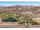 Lake Las Vegas aerial view shows golf course, lakes, residential neighborhoods, walking paths, and mountain views at 58 Sun Lily Ln, Henderson, NV 89011
