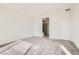 Large primary bedroom with ensuite bathroom with walk in shower and carpet flooring at 58 Sun Lily Ln, Henderson, NV 89011
