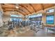 Well-equipped gym featuring modern exercise machines, wood beam ceilings, and large windows with scenic views at 58 Sun Lily Ln, Henderson, NV 89011