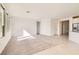 Open-concept living room with tile flooring and seamless access to the kitchen at 58 Sun Lily Ln, Henderson, NV 89011