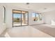Bright living area with tile and carpet, offering seamless indoor-outdoor living at 58 Sun Lily Ln, Henderson, NV 89011