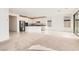 Open floorplan showcases living room leading into a modern kitchen at 58 Sun Lily Ln, Henderson, NV 89011