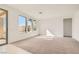 Spacious carpeted living room with large windows offering natural light at 58 Sun Lily Ln, Henderson, NV 89011