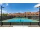 Outdoor tennis courts set against a scenic mountain backdrop, perfect for recreational play at 58 Sun Lily Ln, Henderson, NV 89011