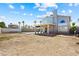 Spacious backyard featuring a covered patio and plenty of room for outdoor recreation and landscaping possibilities at 5950 Pacific Shores Dr, Las Vegas, NV 89142