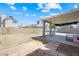 Large backyard with a covered patio, offering ample space for various outdoor activities and relaxation at 5950 Pacific Shores Dr, Las Vegas, NV 89142