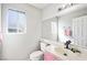 Bathroom features a single sink vanity, new lighting, and a large mirror at 5950 Pacific Shores Dr, Las Vegas, NV 89142