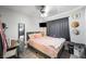 Bedroom featuring ceiling fan, mounted TV, study desk and whimsical decorations at 5950 Pacific Shores Dr, Las Vegas, NV 89142